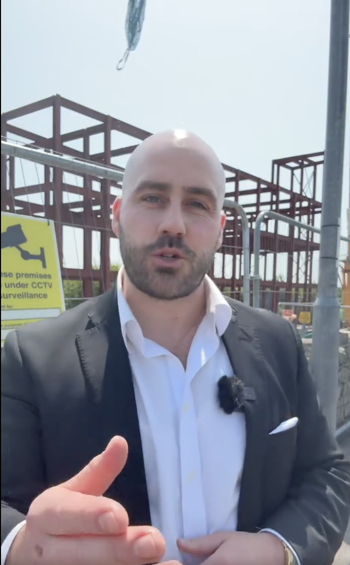 Far-right protester confronting mosque construction workers