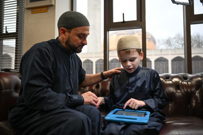 Non-Muslim father and son tour UK mosques in message of solidarity