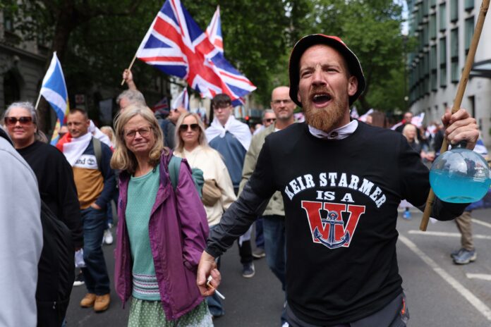 Tommy Robinson’s hate rally mocked as music, march and messaging fall flat