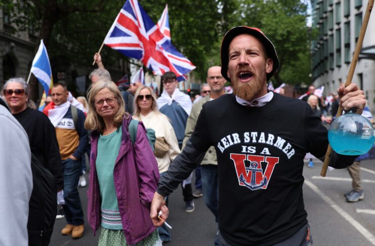 Tommy Robinson’s hate rally mocked as music, march and messaging fall flat