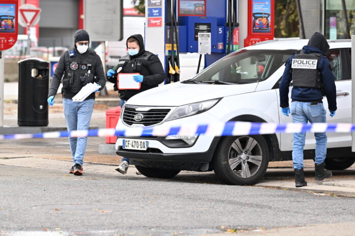 Forensics investigate scene of deadly petrol station drive-by shooting in Paris suburb of Trappes